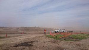 Photograph of erosion in the wind with soil particles forming a haze in the air. (JPG file, 701 KB).