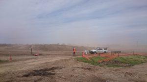 Photograph of erosion in the wind with soil particles forming a haze in the air. (JPG file, 701 KB). 