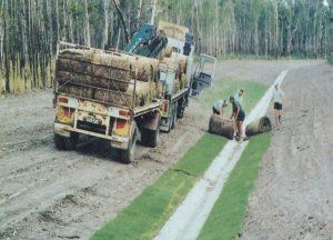 Photograph of turf being laid. 