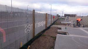 Photograph of silt sock at building site. 