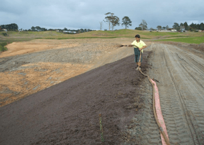 Hydromulch being applied to a slope (Source: Erosion Control Limited).
