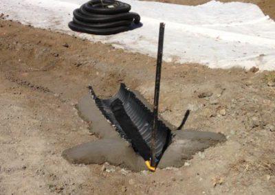 Dirty water will receive flocculent treatment when it flows across a floc sock in the channel upstream of DEB. Note the concrete wingwalls which ensure that the floc sock is not outflanked.