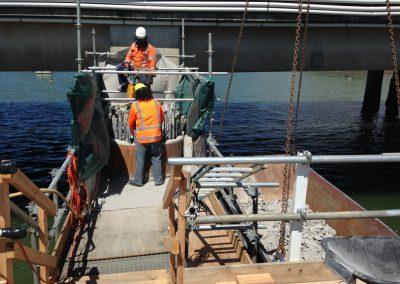 Screens and staging installed to stop concrete and concrete dust dropping into the coastal marine area (Source: SouthernSkies).